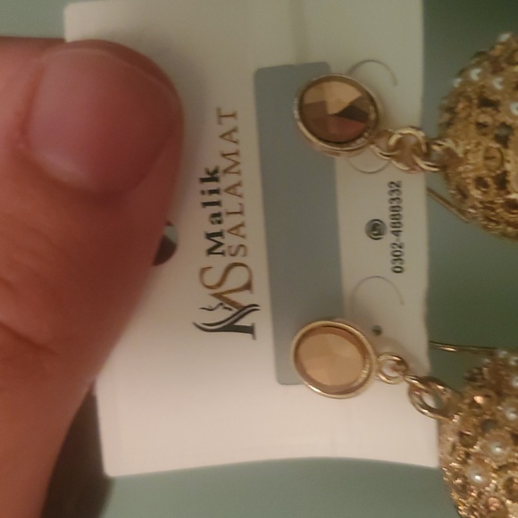 Gold Jhumka Earrings - Picture 2 of 3